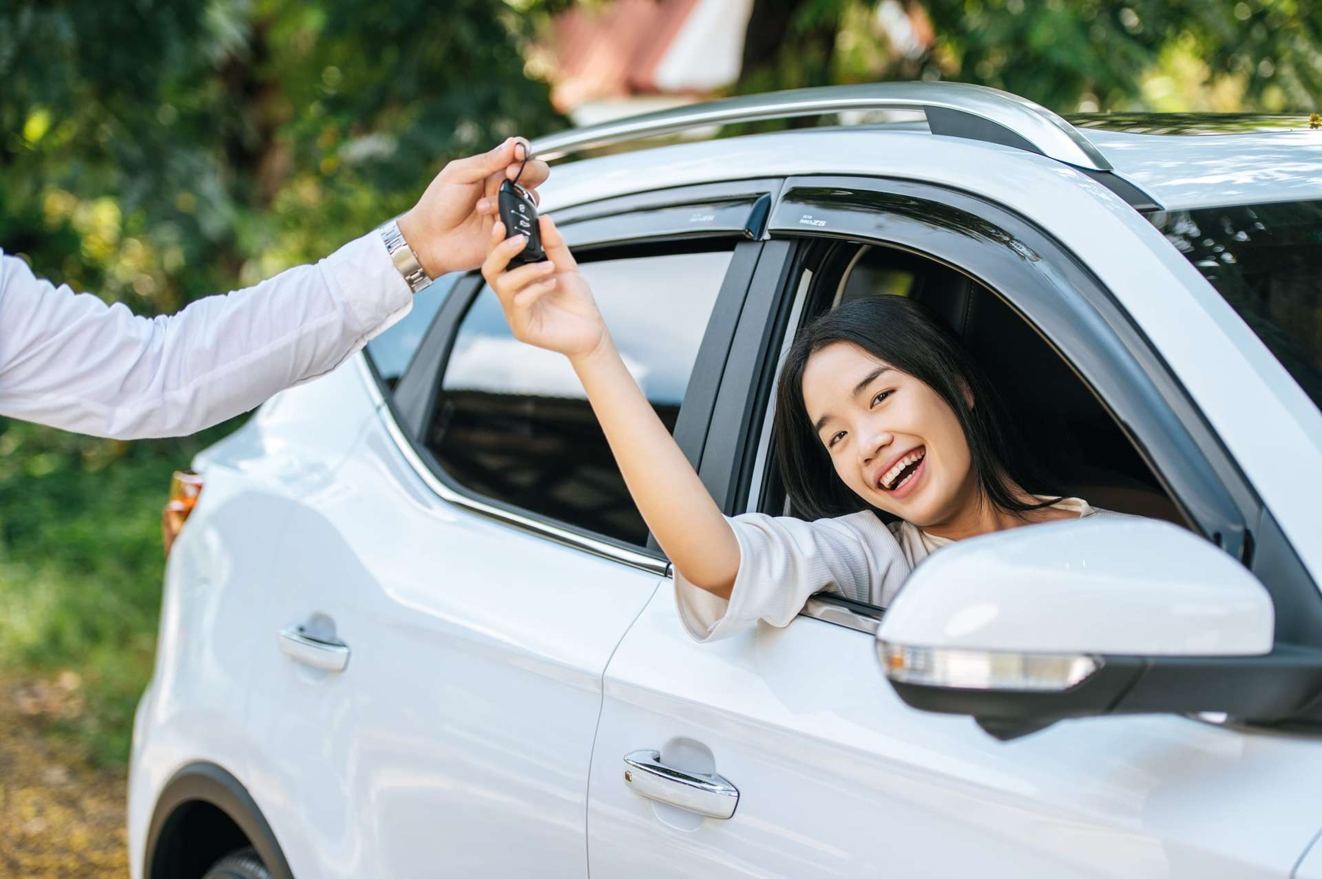 Fresh Cars car rental service hero banner - woman receiving car keys